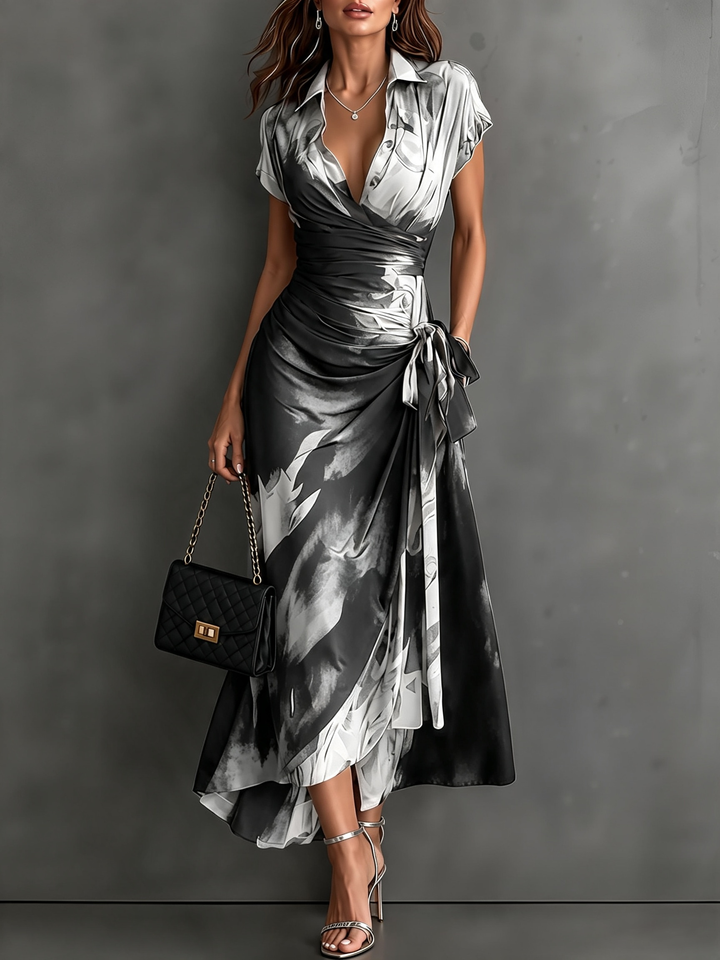 Rosanna | Vestido midi cruzado con estampado abstracto, escote en V, manga corta, cinturón y bajo asimétrico con volante